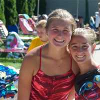 <p>Two members of the Whippoorwill Swim Team pose for a photo.</p>