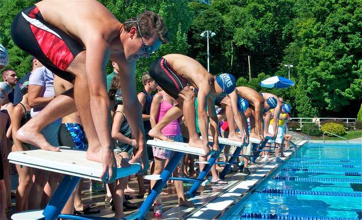 The start of the U18 boys butterfly Sunday morning at the NWSC All Star Swim Meet.