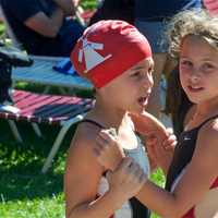 <p>Two friends get each other ready to compete Sunday morning at Briarcliff.</p>