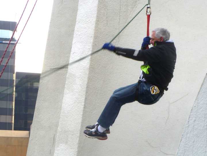 Bobby Valentine finishes a practice run down the Landmark Square Building on Friday in preparation for Stamford&#x27;s Heights and Lights this Sunday.