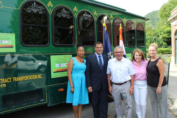 Dutchess County Legislator April Marie Farley, Marc Molinaro, Randy Casale, Putnam County Legislator Barbara Scuccimarra and MaryEllen Odell celebrate the launch of the inter-county shuttle that will transport riders to Cold Spring and Beacon.