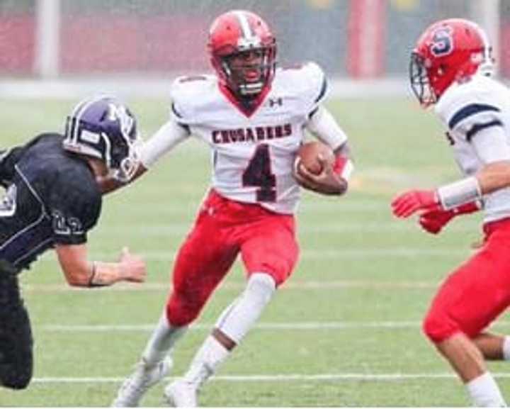 Archbishop Stepinac quarterback Tyquell Fields runs upfield during a game last year.