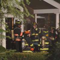 <p>Firefighters respond to a fire in an Armonk house&#x27;s attached garage.</p>