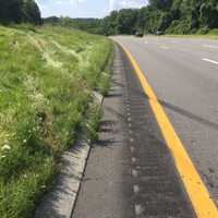 <p>From another angle, a look at the  tire marks and tracks in the northbound lane where the BMW SUV exited  into the center median, struck an earth embankment, and became airborne into the southbound lanes</p>