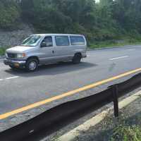 <p>A look at the southbound lane where the BMW landed and collided with two other vehicles on Saturday. A third vehicle was also involved in the collision.</p>