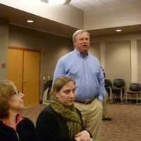 <p>Ben Bilus, standing, of New Canaan talks to emergency officials during Thursday&#x27;s post-Hurricane Sandy response meeting. </p>