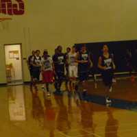 <p>Brien McMahon boys basketball players warm up before a recent practice.</p>