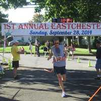 <p>Michael Nobles, winner of last year&#x27;s Eastchester 5K Race, crosses the finish line</p>