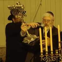 <p>Hecht presents a menorah to Mayor Richard Moccia and the city of Norwalk, which will be on display at City Hall.</p>