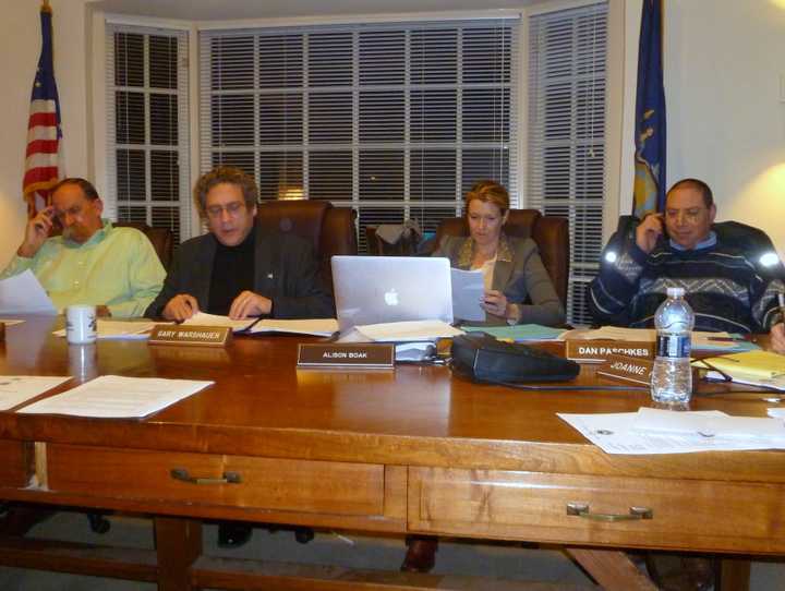 The Pound Ridge Town Board will hold a public hearing on a local law that will set up a loan program for commercial buildings to help make them more energy efficient. From left, Dick Lyman, Supervisor Gary Warshauer, Ali Boak and Dan Paschkes.