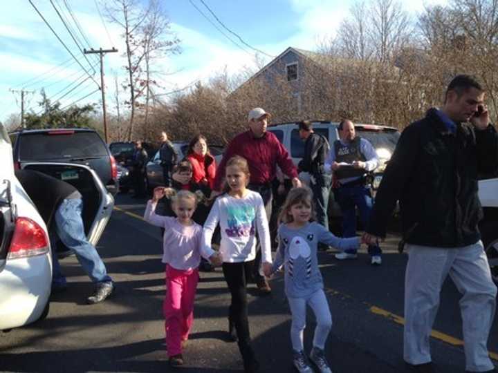 The scene outside Sandy Hook Elementary School in Newtown, Conn., Friday after a gunman opened fire inside the school.