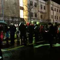 <p>People lined up outside Newtown High School, where President Obama was meeting with first responders and families of the victims of the Sandy Hook School shooting.</p>