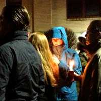 <p>People lined up outside Newtown High School, where President Barack Obama was meeting with first responders and families of the victims of the Sandy Hook Elementary School shooting.</p>