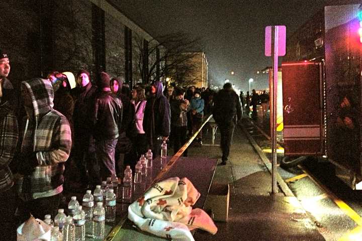 People lined up outside Newtown High School on Sunday evening, hoping for a chance to hear President Barack Obama speak.