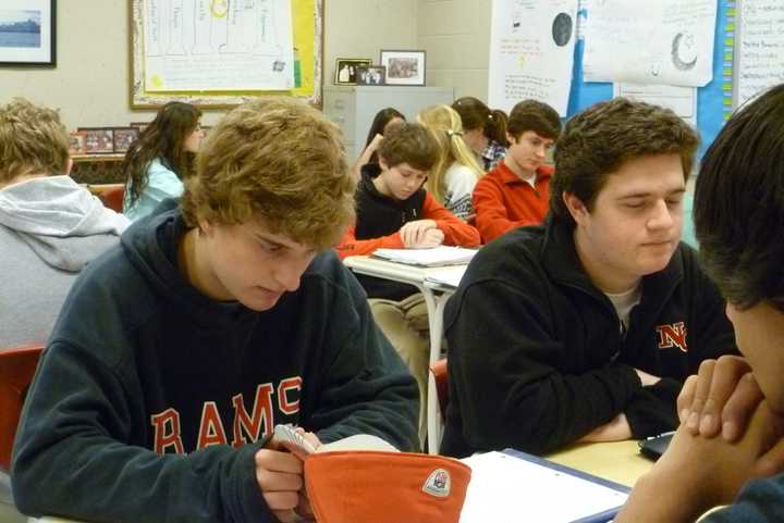 Students in Susan Steidl&#x27;s class at New Canaan High School observe a moment of silence to remember the victims of the tragedy at Sandy Hook Elementary School in Newtown. 