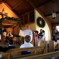 <p>The Rev. Eric Hall. pastor of Eastchester Community Church, addresses his congregation during the live nativity scene Sunday.</p>