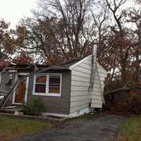 <p>Hurricane Sandy knocked a tree onto this house on Forest Avenue in Danbury. </p>