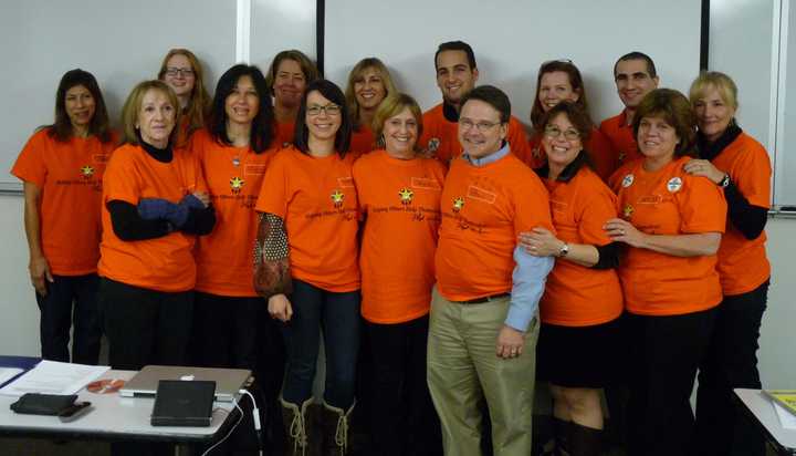 Front row:  Elaine Grandolfi, Maria DeRosa, Justyna Szyszka, Ann Milit, Phil Faranda, Dina Morra, and Kathleen Courtney. Back row: Jane Tarpey, Lauchlan Paul, Deborah McNerney, Diana Cirocco, Alex Cesarini, Rosanne Fluet, Tom Ricapito and Karen Foss.