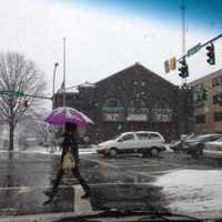 <p>Residents endure the snow on Mamaroneck Avenue in White Plains Saturday. </p>