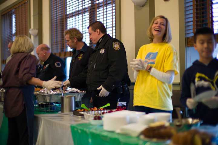 Sleepy Hollow resident Kristen Idalski has a good laugh while serving food at the annual New Year&#x27;s Day Community Meal.