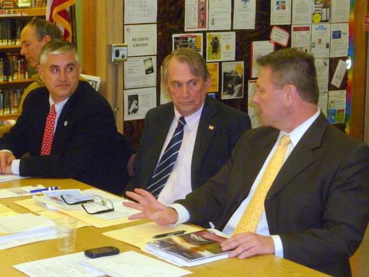 Members of the Lewisboro Town Board discuss committee appointments at its organizational meeting. From left, Dan Welsh, Peter DeLucia, Supervisor Peter Parsons, and Frank Kelly