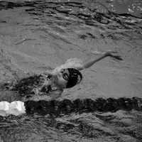 <p>Jessica Garcia works her backstroke.</p>