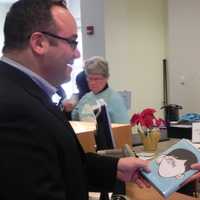 <p>Bob Sussman, treasurer of Fairfield&#x27;s Board of Library Trustees, is one of the first to check out &quot;Wonder&quot; with the help of librarian Anne Farkas.</p>