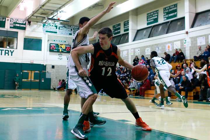 Ridgefield&#x27;s Jeff Racy makes a move in the paint.