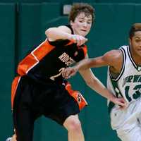 <p>Ridgefield&#x27;s Charles Irwin defends against Norwalk&#x27;s Jeremy Linton.</p>