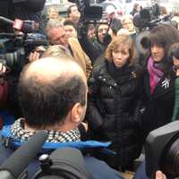 <p>Lori Haas, whose daughter was shot and injured in the Virginia Tech shooting in 2007, helped deliver a petition in Danbury on Tuesday calling for Walmart to halt gun sales.</p>