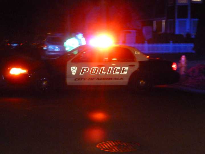 Norwalk police cruisers block Blackstone Drive on Tuesday night where Officer Kenneth Cerulli fatally shot himself.