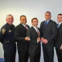 <p>Officer Kenneth Cerulli, second from the right next to Norwalk Mayor Richard Moccia, was one of six officers hired in February 2011.</p>