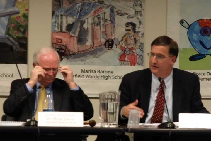 Superintendent David Title (right) explains his 2013-2014 budget plan to chair Philip Dwyer (left) and the Fairfield Board of Education.