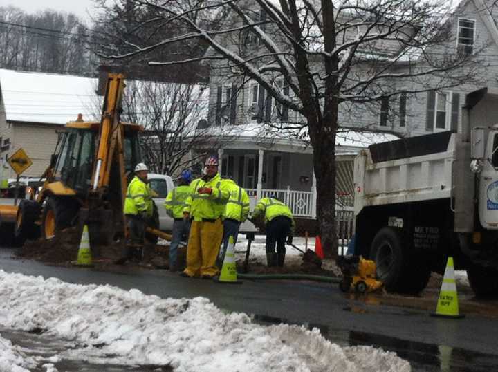 City crews work to repair a broken water main on Locust Avenue at Roberts Avenue. 