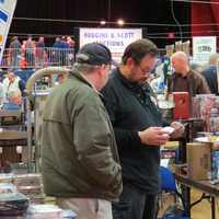 <p>Sports card vendors discussed classic sports moments and card values on Sunday at The Westchester County Center.</p>