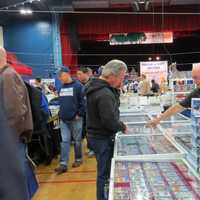 <p>Collectors pored over hundreds of cards looking for a steal. </p>