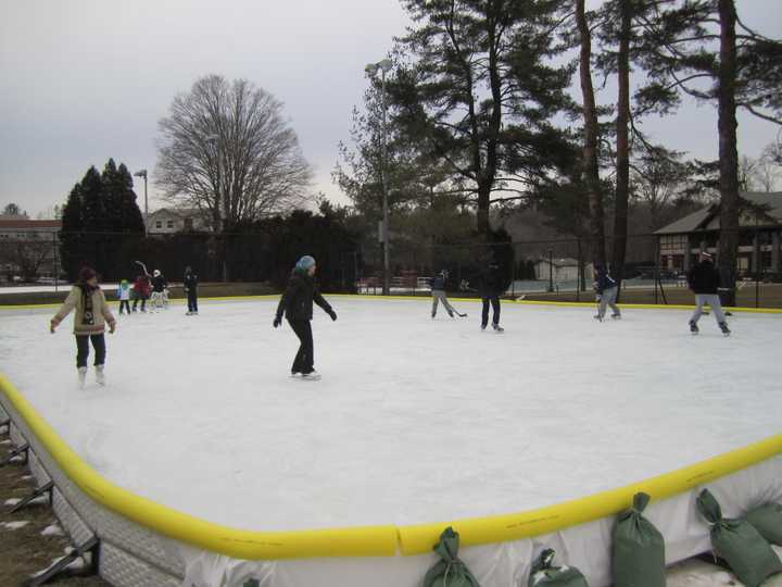 Briarcliff Manor residents skate on the newly opened ice rink at Law Memorial Park on Friday. 