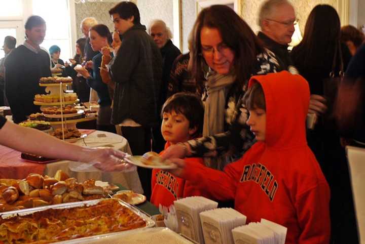 Kristina Kelly and her two sons, Declan, 5, and Aidan, 6, visited the Tom Tom&#x27;s station first at the Taste of Ridgefield before going to try more of what was available. 