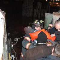 <p>Emergency service personnel take one of the victims off a rescue boat Sunday evening  after a plane crashed in the Hudson River. </p>