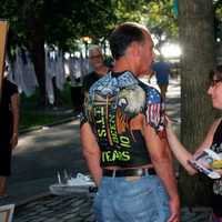 <p>Somers artist Jennifer Siciliano paints a 9/11 first responder at a Ground Zero 10th anniversary event.</p>