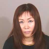 <p>Hasung Chipman, 47, of West Street, Danbury, was charged with performing massage therapy without a license.</p>