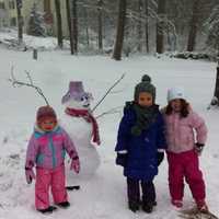 <p>Sisters Eliana and Madelyn Soccio, 5 and 2 respectively, built a snowman along with friend Riley Stewart, 5, outside the Soccio residence on Arrowhead Trail. </p>