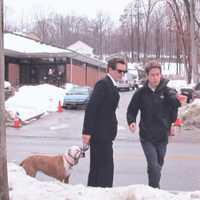 <p>Kevin Bacon, star of the Fox TV show &quot;The Following,&quot; walks his dog while on set outside of the Town of Ossining Police Station in Briarcliff Manor.  </p>