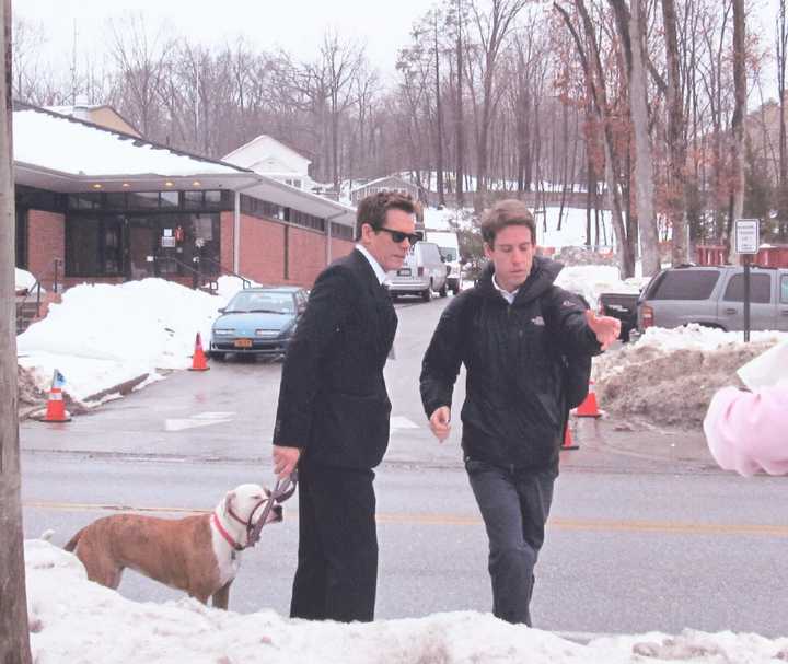 Kevin Bacon, star of the Fox TV show &quot;The Following,&quot; walks his dog while on set outside of the Town of Ossining Police Station in Briarcliff Manor.  