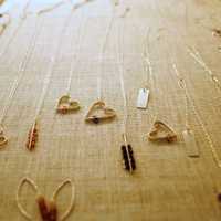 <p>A sample of jewelry by Amy Tucker, owner of the company Black Swallow, is on display at the show at Rutheny Jewelers.</p>