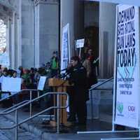 <p>Stephen Barton, a survivor of the Aurora, Colo,. shooting, addresses the crowd in Hartford.</p>