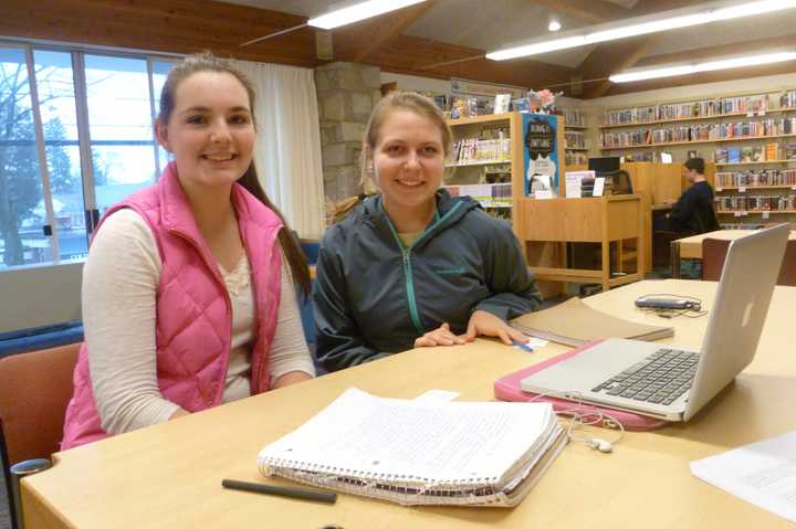 Molly Tricomi, left, and friend Ekaterina Dyakova, both 16 and juniors at New Canaan High School, spend part of their Tuesday away from school studying at New Canaan Library. 