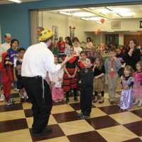 <p>Children receive prizes for coming dressed in costume to the family Purim celebration organized by Chabad of Yorktown.</p>