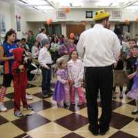 <p>Children receive prizes for coming dressed in costume to the family Purim celebration organized by Chabad of Yorktown.</p>