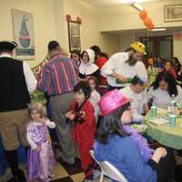 <p>Purim is celebrated by giving gifts of food and drink, wearing costumes and giving charity to the poor.</p>